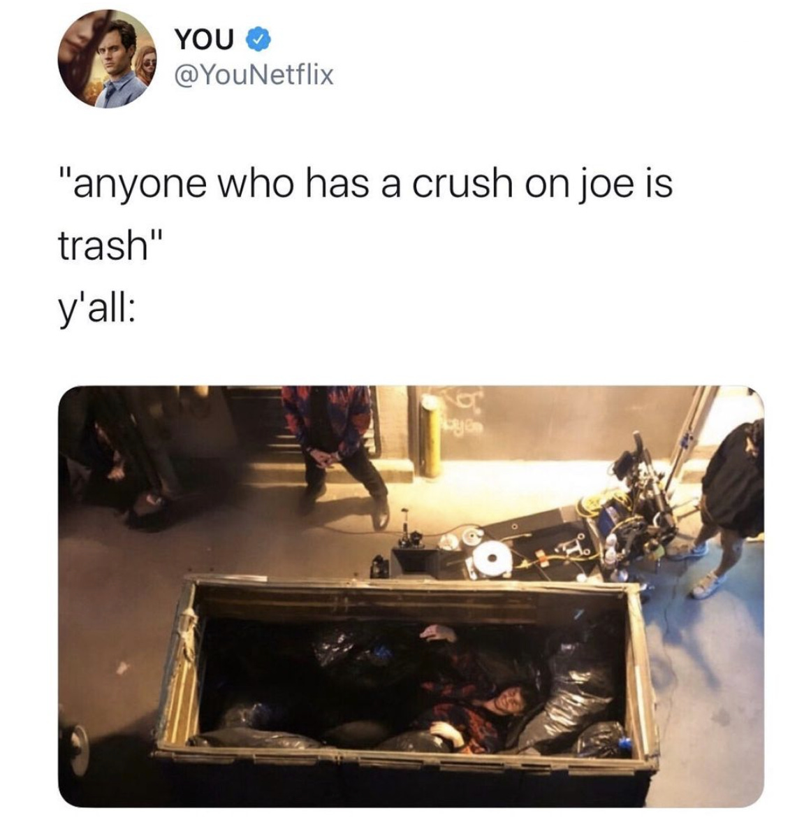 From the “YOU” IG page: “anyone who has a crush on joe is trash” Ya’ll: photo of a person laying happily in a dumpster