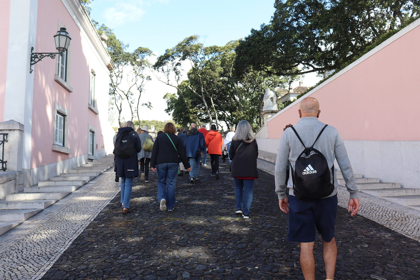 People walking up the Presidential Palace driveway