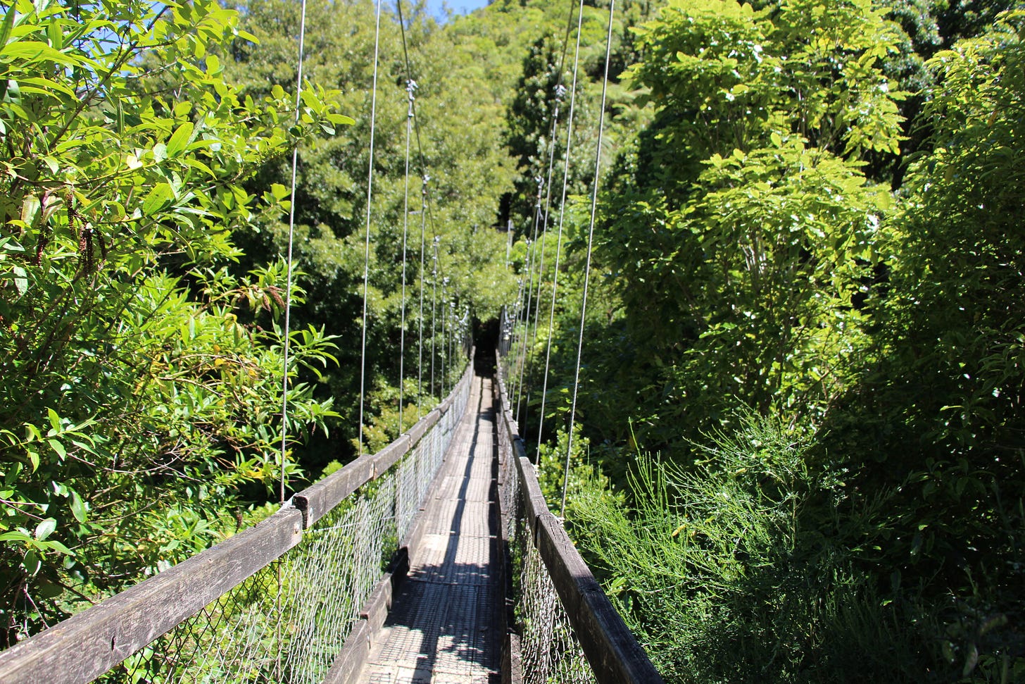 the start of a wooden swing bridge