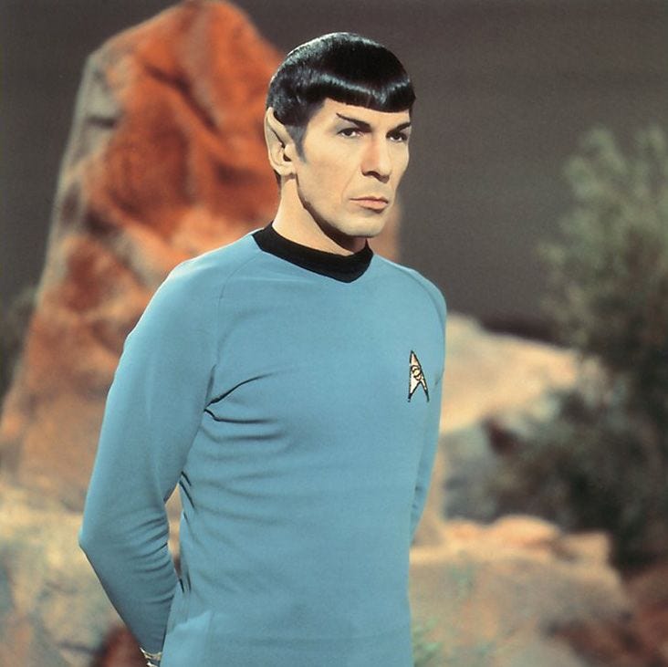 Mr. Spock, his hands clasped.