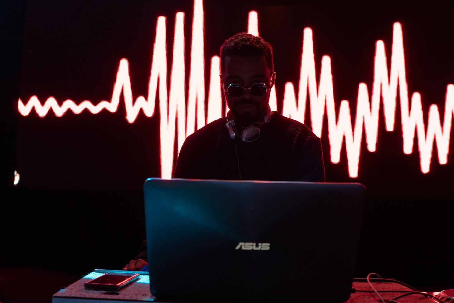 man sits at computer before pulse data
