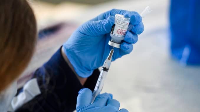 A healthcare worker fills a syringe with Moderna COVID-19 vaccine. At the Giorgio Companies site in Blandon, PA where the CATE Mobile Vaccination Unit was onsite to administer Moderna COVID-19 Vaccines to workers Wednesday morning April 14, 2021.