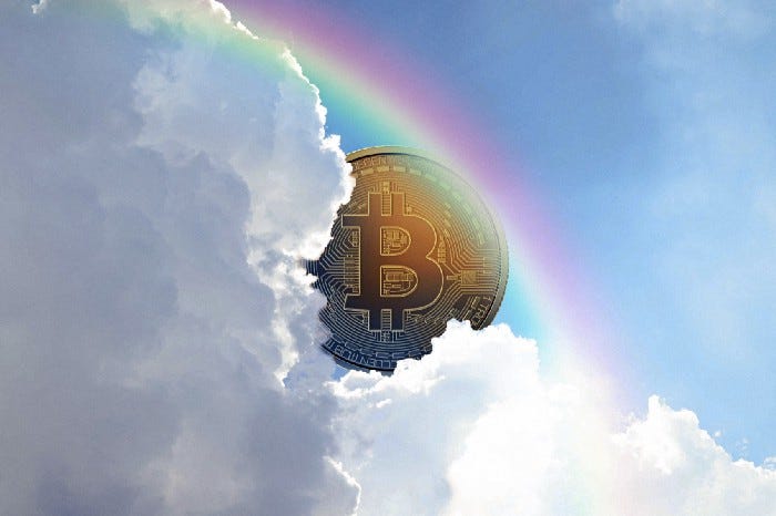 An illustration of a conceptual Bitcoin placed behind clouds in the sky as a rainbow crosses the sky.