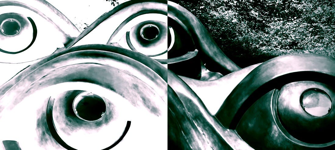 split photo and negative of sculpture of eyes