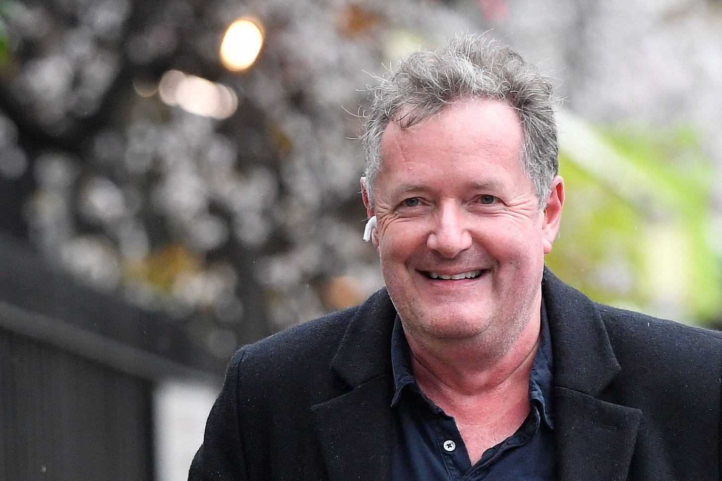 Journalist and television presenter Piers Morgan smiles as he walks near his house, after he left his high-profile breakfast slot with the broadcaster ITV, following his long-running criticism of Prince Harry's wife Meghan, in London, Britain, March 10, 2021. REUTERS/Toby Melville