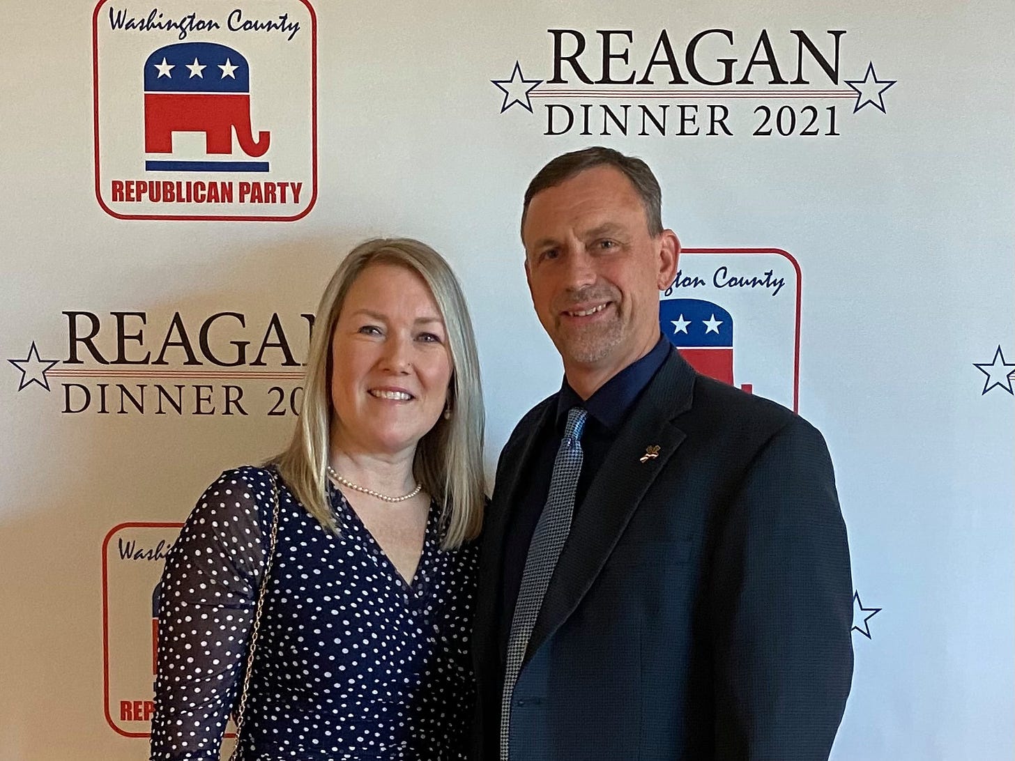 May be an image of one or more people, people standing and text that says 'Washington County REPUBLICAN PARTY REAGAN DINNER 2021 fton County REAGAT DINNER 20 000 Washi REP'