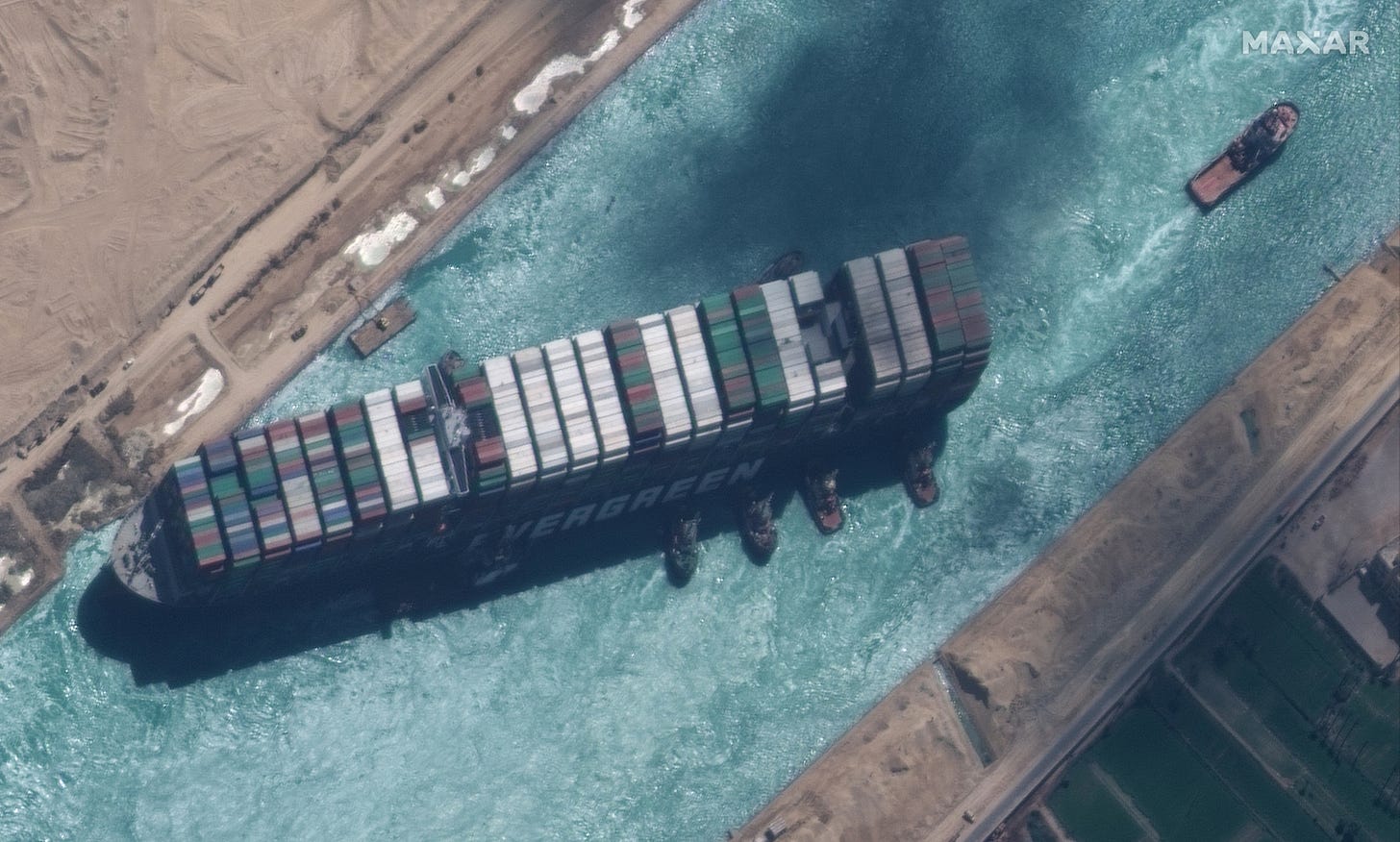 How did Ever Given ship get stuck in the Suez Canal and how was it freed?