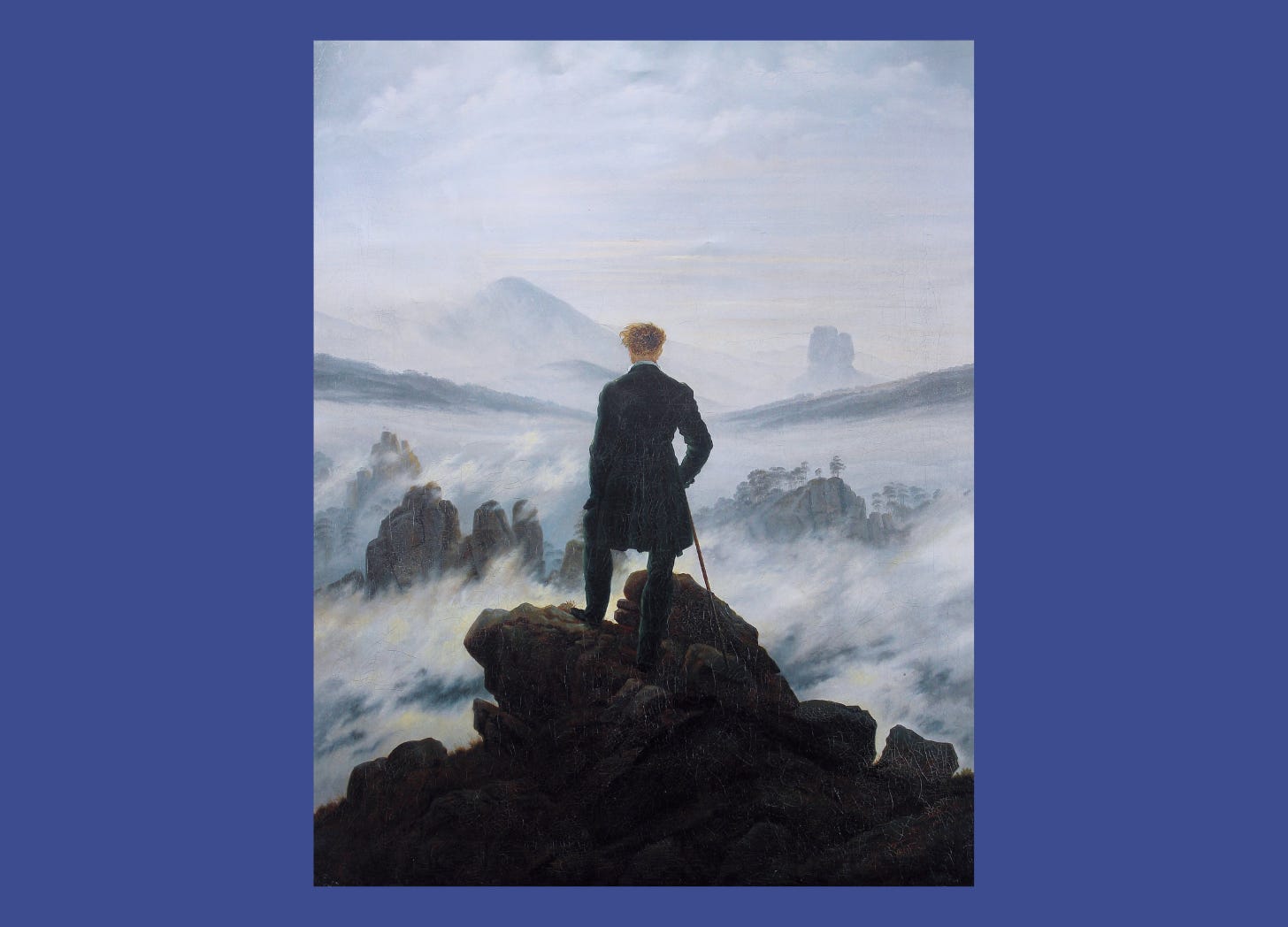 A hiker stands with his back to the viewer. He looks down on an almost impenetrable sea of ​​fog in the midst of a rocky landscape.
