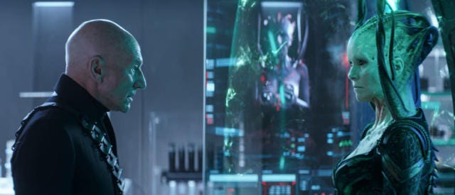 This image shows General Jean-Luc Picard (played by Patrick Stewart) on the left and the Borg Queen (played by Annie Wersching) on the right. This image shows General Jean-Luc Picard (played by Patrick Stewart) on the left and the Borg Queen (played by Annie Wersching) on the right.