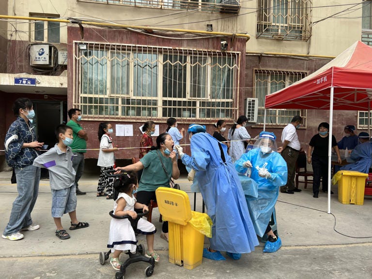Residents of Kashgar in the Xinjiang region line up for coronavirus testing on Aug. 5.