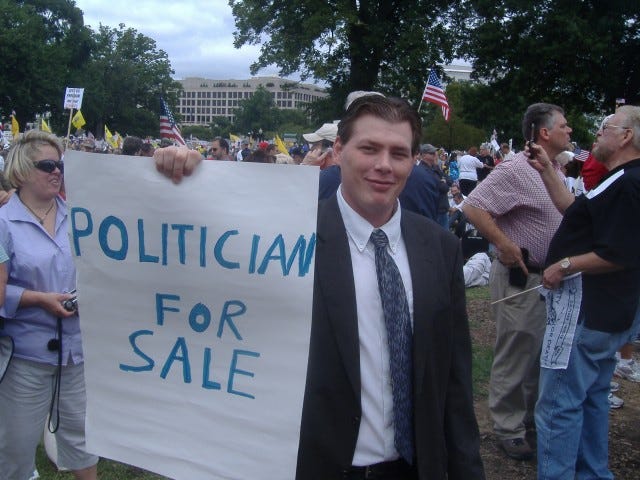 The only thing missing from this guy's getup was money hanging out of his pockets. But he certainly looked the part - just hope he never actually runs for office with this picture all over the internet.