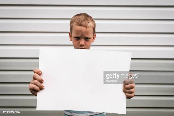 203 Sad Child Holding Sign Photos and Premium High Res Pictures - Getty  Images