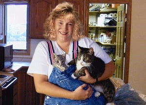 Annette Davrian with cats Buttons and Bonkers.