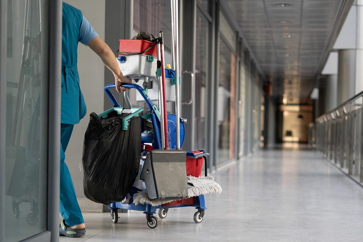 A person pushing a cart full of luggage

Description automatically generated with medium confidence