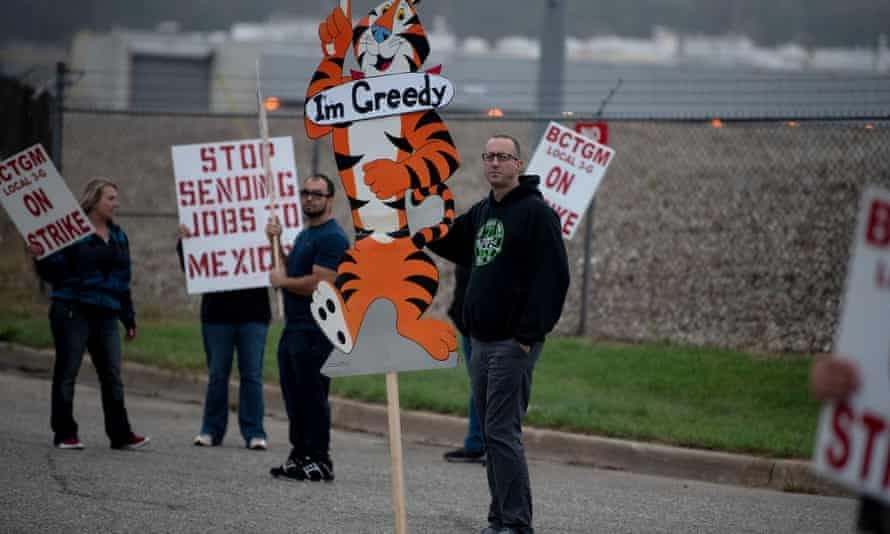 Travis Huffman joins other BCTGM Local 3G union members in a strike against Kellogg’s at the plant on Porter Street in Battle Creek, Michigan, on Tuesday.