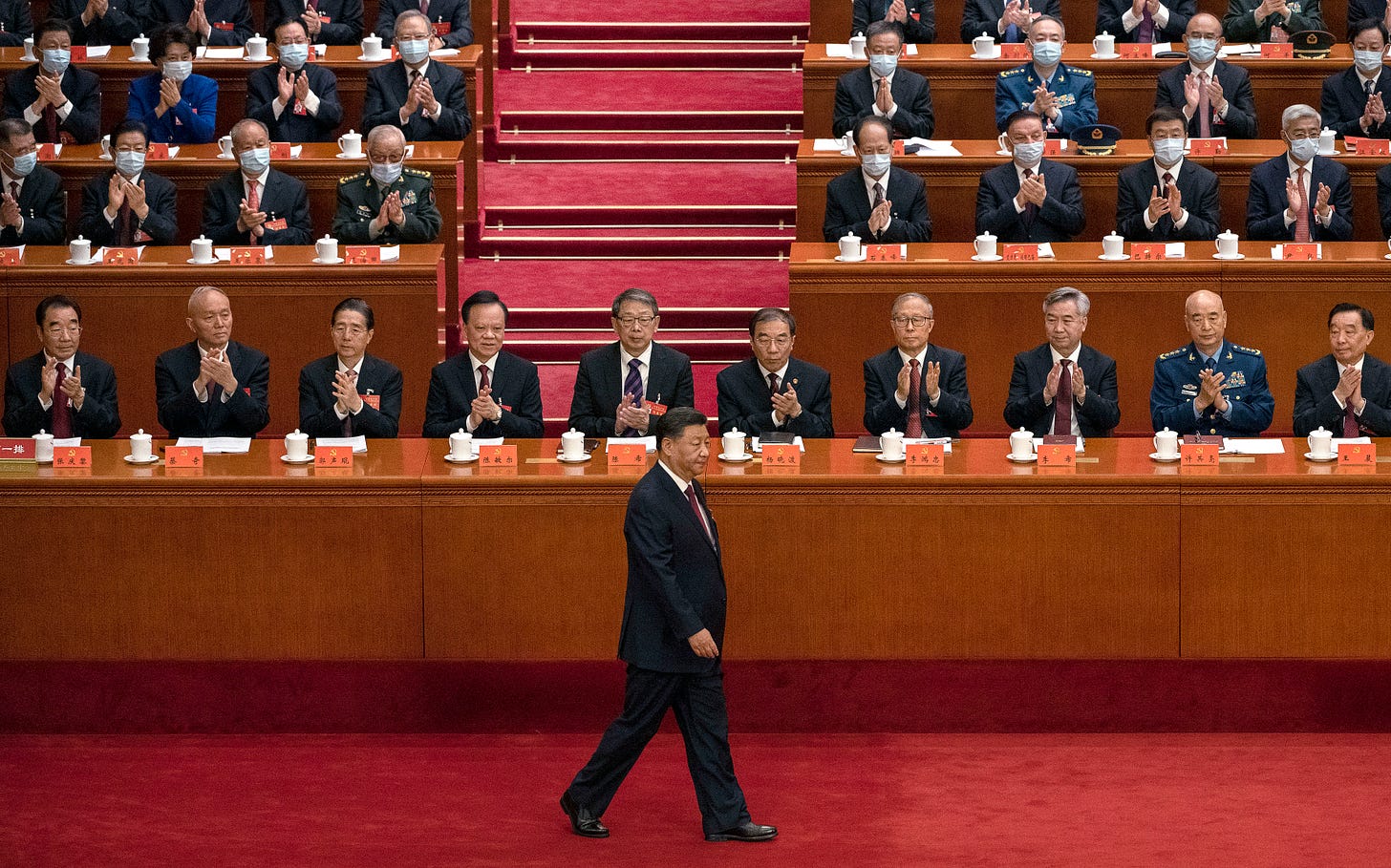 Chinese President Xi Jinping walks to the podium before his speech during the Opening Ceremony of the 20th National Congress of the Communist Party of China on October 16, 2022 in Beijing. (Photo by Kevin Frayer/Getty Images).