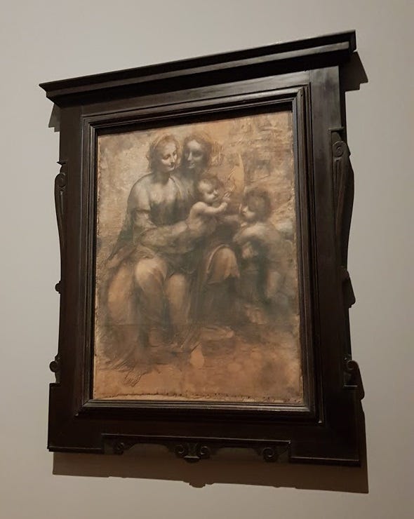 Da Vincis Santa Anna tredje i en mörk ram.