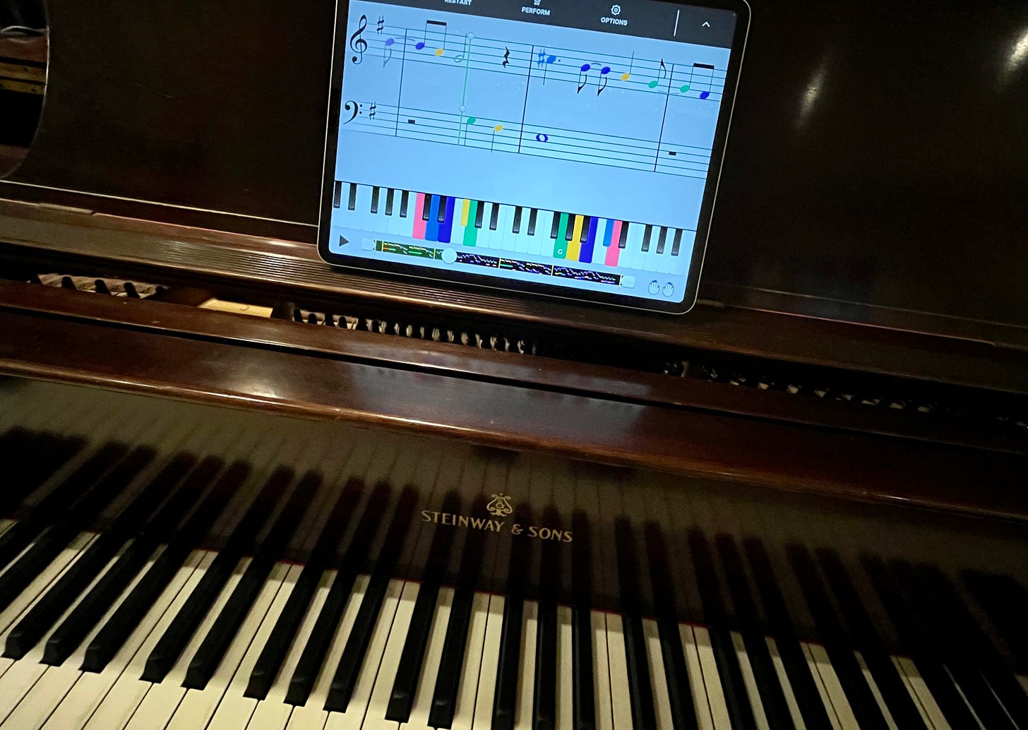 Steinway piano with Yousician app on iPad