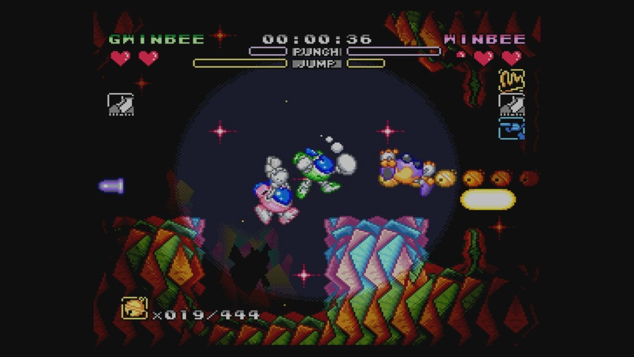 A screenshot from the European version of Rainbow Bell Adventures, featuring GwinBee and WinBee jumping within a cavern.