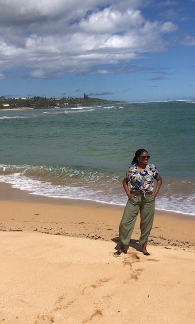 Chi-Chi standing on the beach in front of the ocean