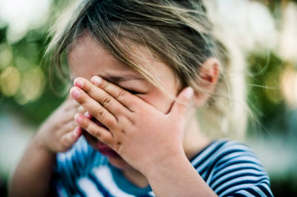 young girl crying with hands covering face - crying child stock pictures, royalty-free photos & images