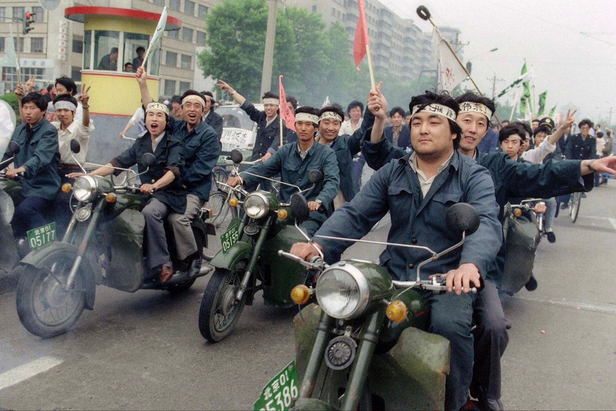 Factory workers on Their Way to Tiananmen Square, Beijing 1989 - by Catherine Henriette/AFP/Getty