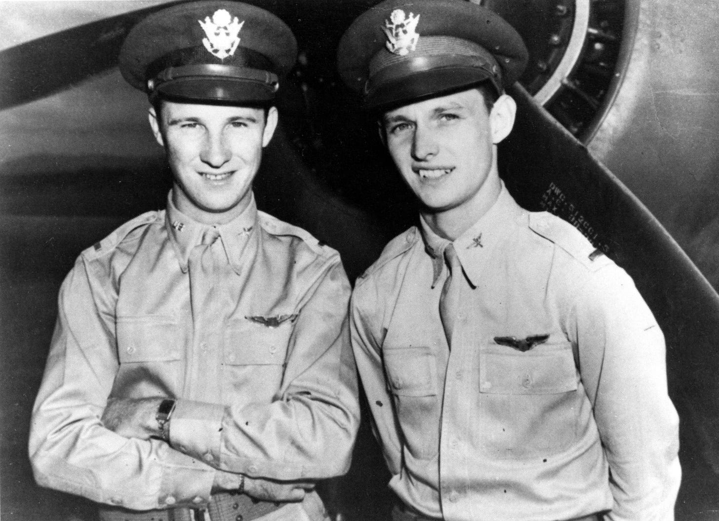 Army Air Corps 2nd Lts. Ken Taylor and George Welch pose in front of a plane. 