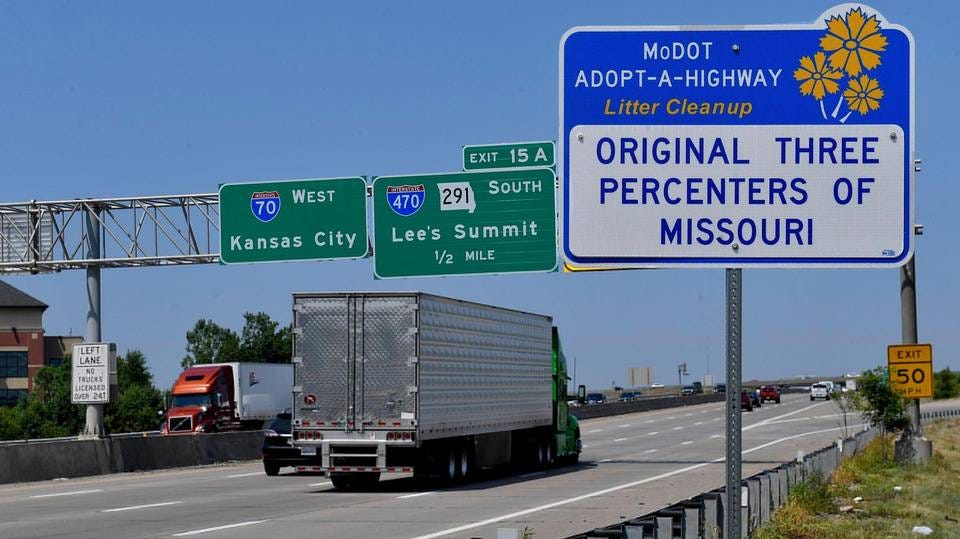 Photo of an adopt-a-highway sign along I-70 advertising “The Original Three Percenters of Missouri”