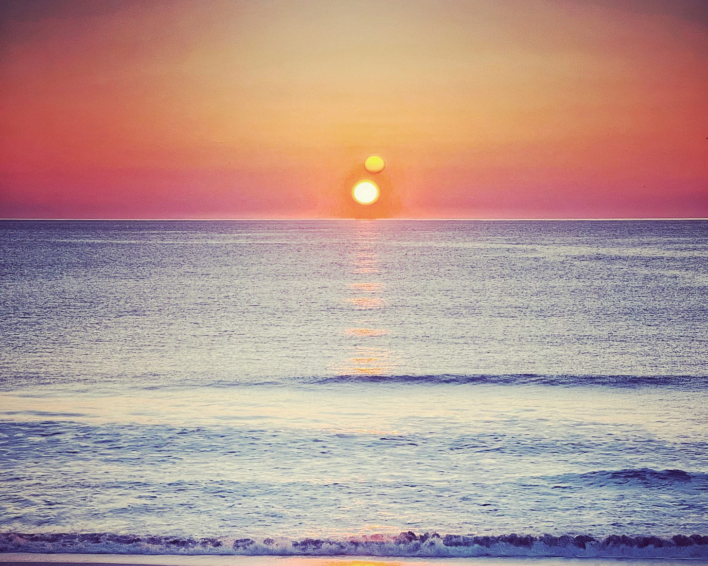 Sunset over a calm ocean 