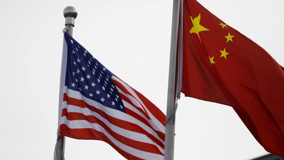 Chinese and U.S. flags flutter outside the building of an American company in Beijing, China January 21, 2021.