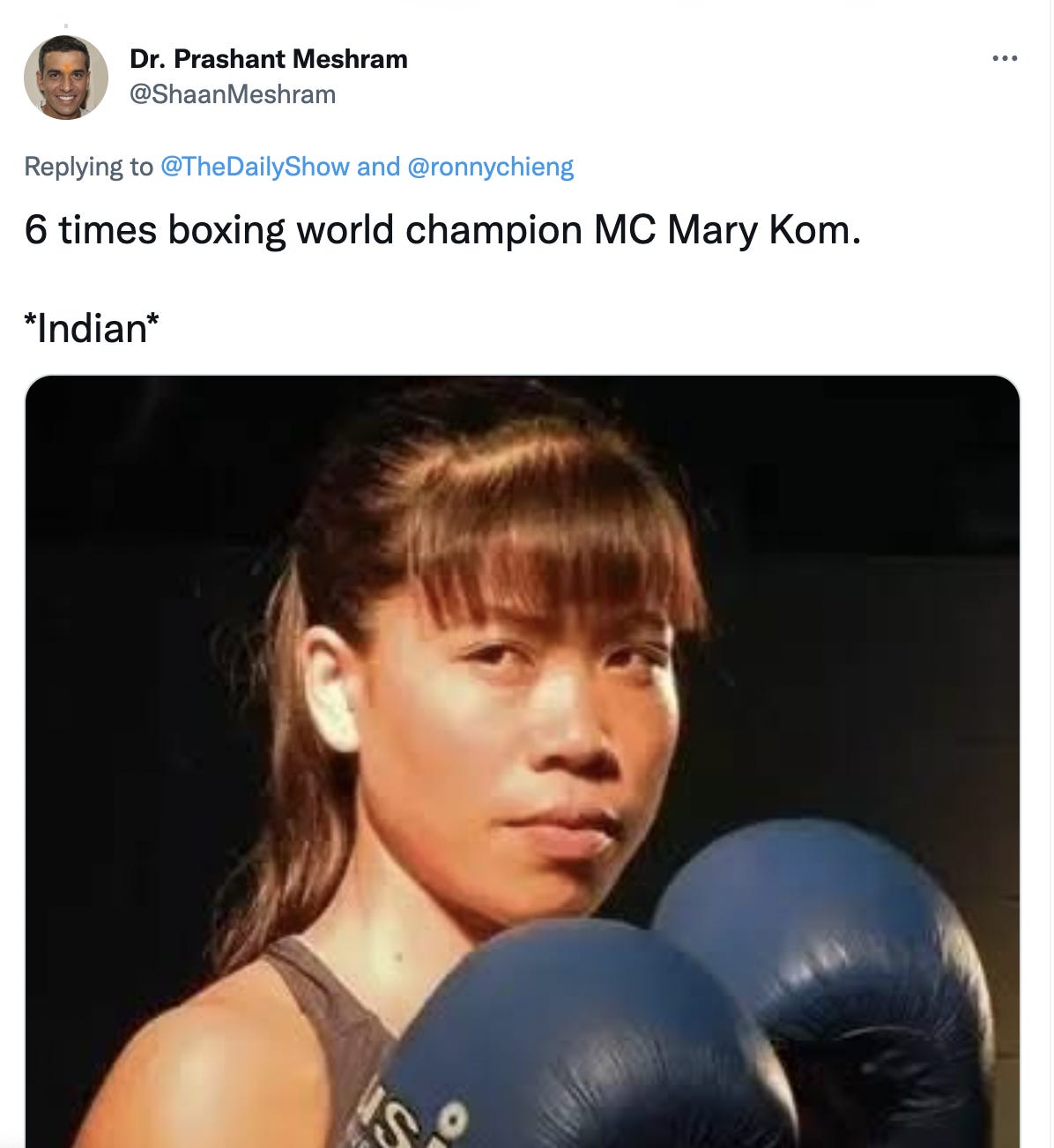 Tweet from Dr. Prashant Meshram in black font on a white background reads: “6 times boxing world champion MC Mary Kom. *Indian*” Below that is a picture of Mary Kom wearing boxing gloves and a tank top with her hair tied up in a ponytail.