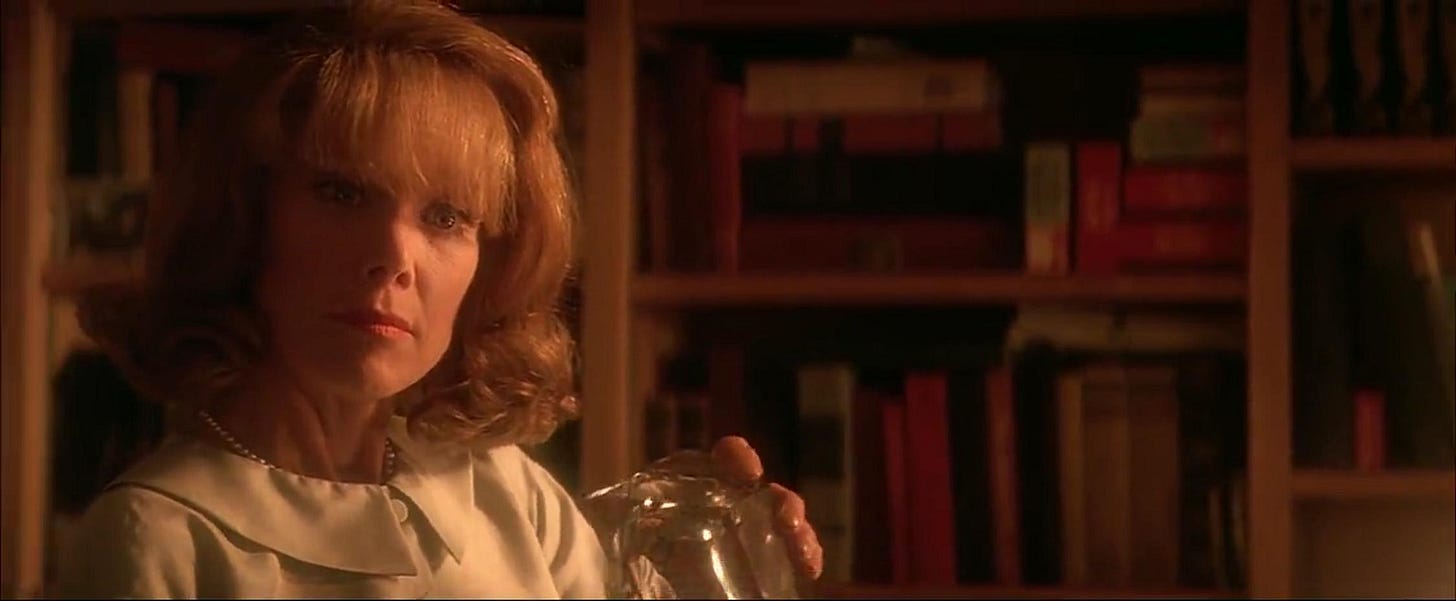 This image shows Liz Garrison (played by Sissy Spacek), Jim Garrison's wife, inside the Garrison home's study in Oliver Stone's 1991 film JFK. This image shows Liz Garrison (played by Sissy Spacek), Jim Garrison's wife, inside the Garrison home's study in Oliver Stone's 1991 film JFK.