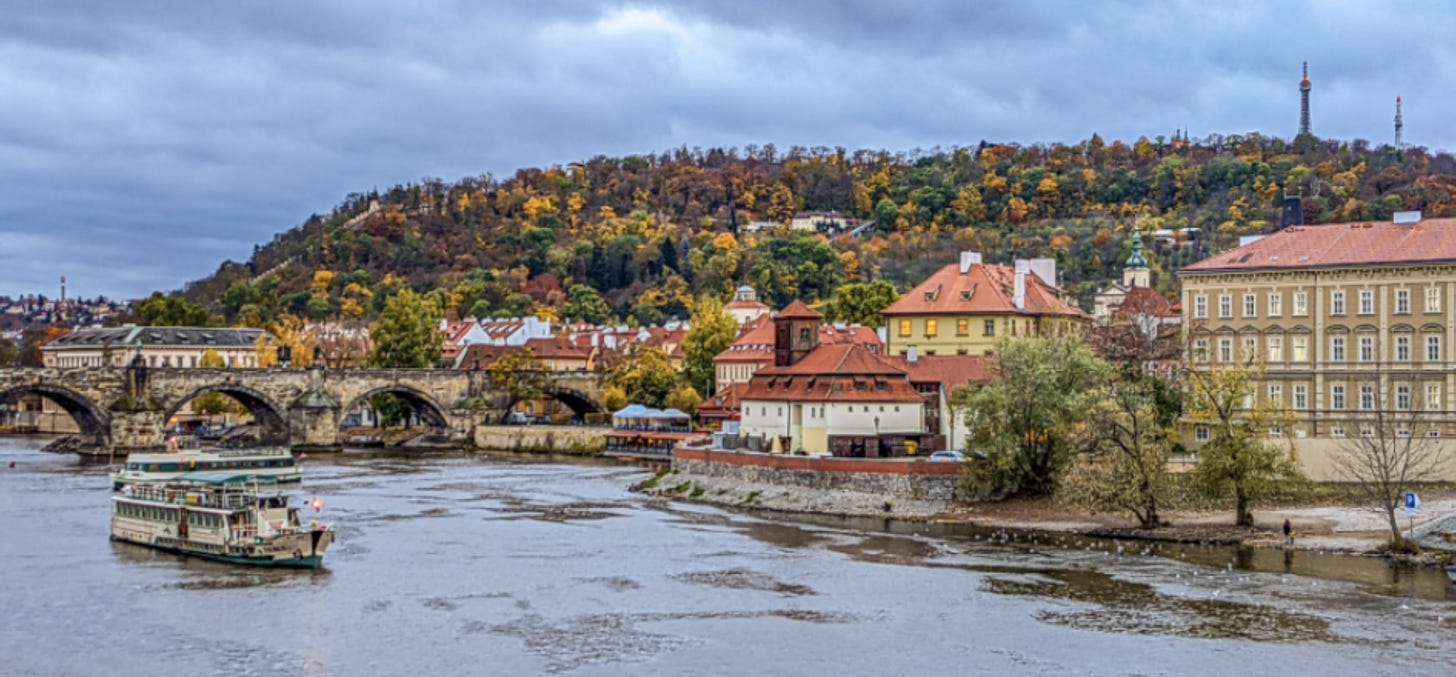 Petrin Hill, gorgeous in fall colors of red, gold, yellow, and orange overlooks the Vltava River in Prague.