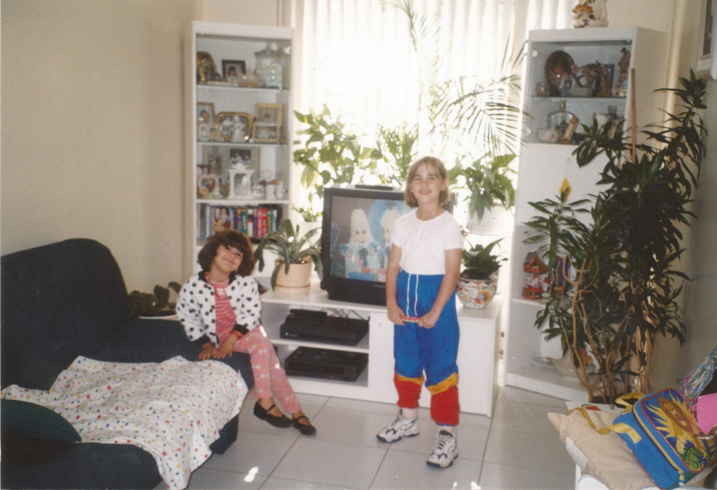 Cassandra and her sister in their grand-parents' living room in the 90s.