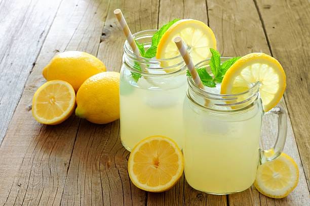 Mason jar glasses of homemade lemonade on rustic wood  lemon lemonade stock pictures, royalty-free photos & images