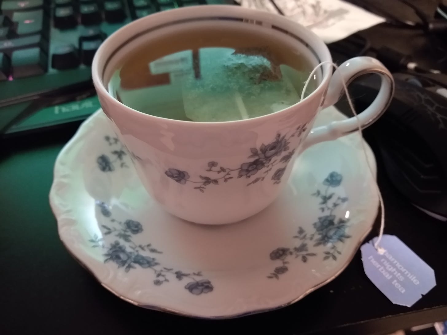 Teacup of Chamomile Nights herbal tea, on a saucer