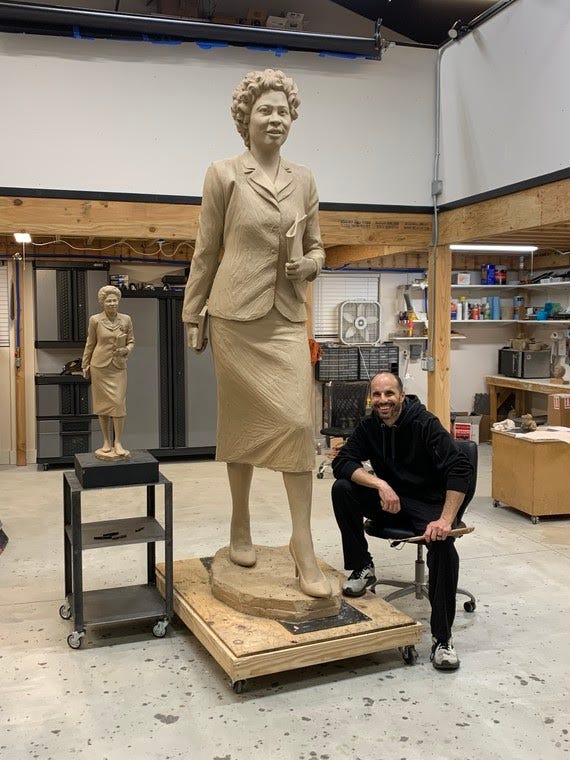 Artist Benjamin Victor works on his sculpture of Daisy Bates.