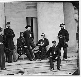 Union officers lounge on the portico of the Arlington House during the Civil War.