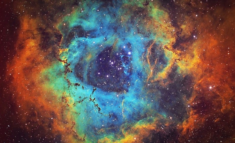 The Rosette Nebula 5,200 light years away (Source).
