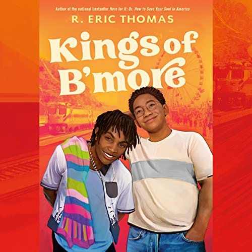 The audiobook cover of Kings of B’more, showing two Black teenagers standing next to each other in front of a train station.