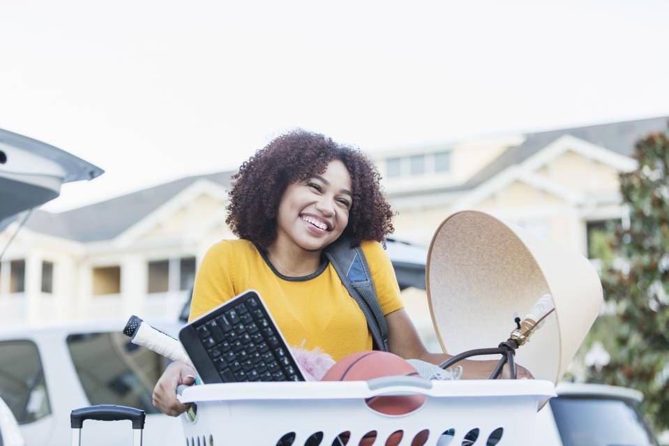 Young African-American woman moving house