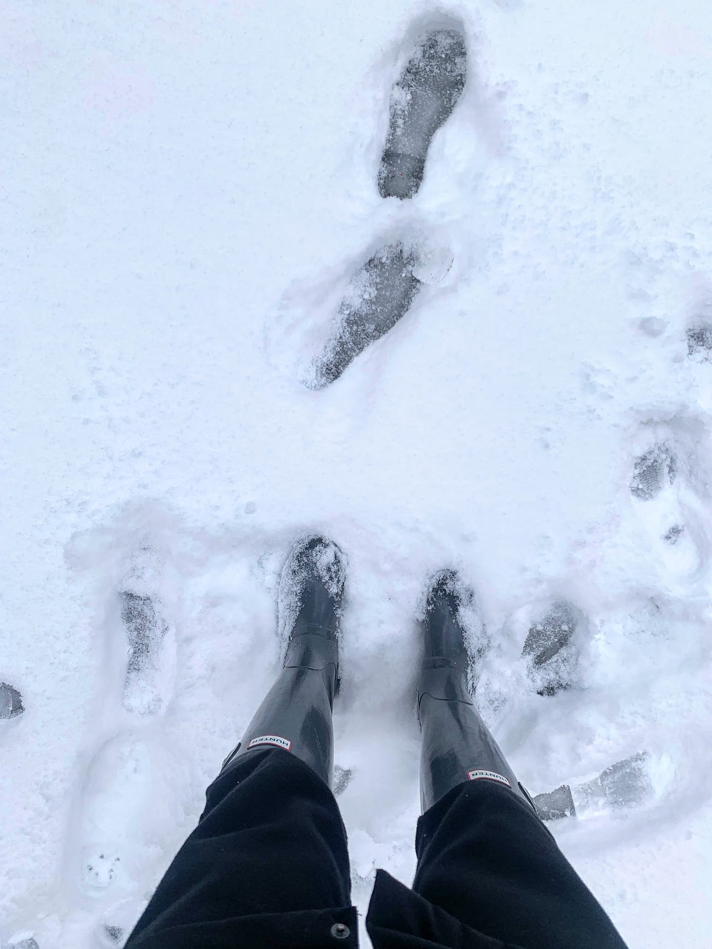 Rainboots and footprints in snow