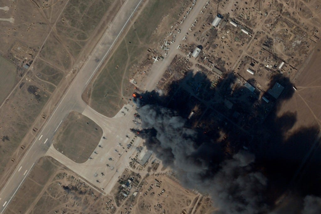 In this satellite picture provided by Planet Labs PBC, fire and smoke is seen at Kherson International Airport and Air Base in Kherson, Ukraine on March 15, 2022.