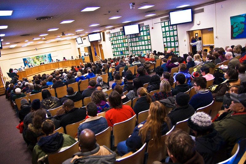 Everyday people in a school council meeting