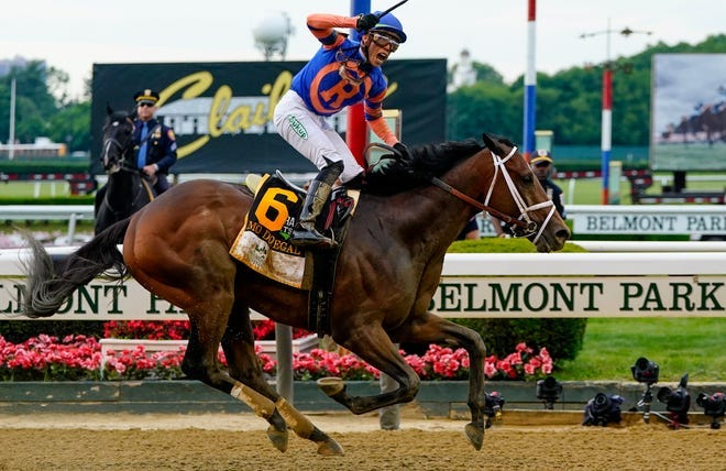 Mo Donegal, with jockey Irad Ortiz Jr. aboard, crosses the finish line to win the 154th running of the Belmont Stakes.