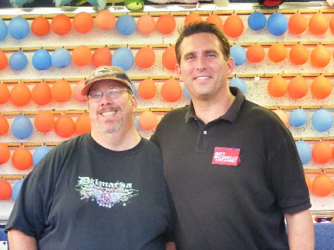 Kim took this picture of Matt and I at the St. Francis carnival. But we didn't toss any darts.