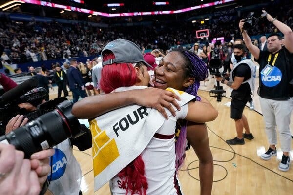 Victaria Saxton, left, and Aliyah Boston, right, sharing a hug after winning a national championship for South Carolina.
