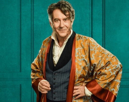 Mr. Wickham reprised: Adrian Lukis’s one-man theater performance is streaming until April 30th with the Original Theatre. Portraying Wickham on his 60th birthday, he sips brandy, philosophizes in ways that are thought-provoking if self-serving, and delivers some delightfully unexpected endings. Mr. Wickham reprised: Adrian Lukis’s one-man theater performance is streaming until April 30th with the Original Theatre. Portraying Wickham on his 60th birthday, he sips brandy, philosophizes in ways that are thought-provoking if self-serving, and delivers some delightfully unexpected endings.