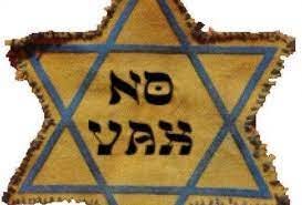 Photo of yellow star with the words "no vax" in the center in Hebraized letters. Anti-Vaccine Protesters Misappropriate Holocaust-Era Symbol to Promote  Their Cause | Anti-Defamation League