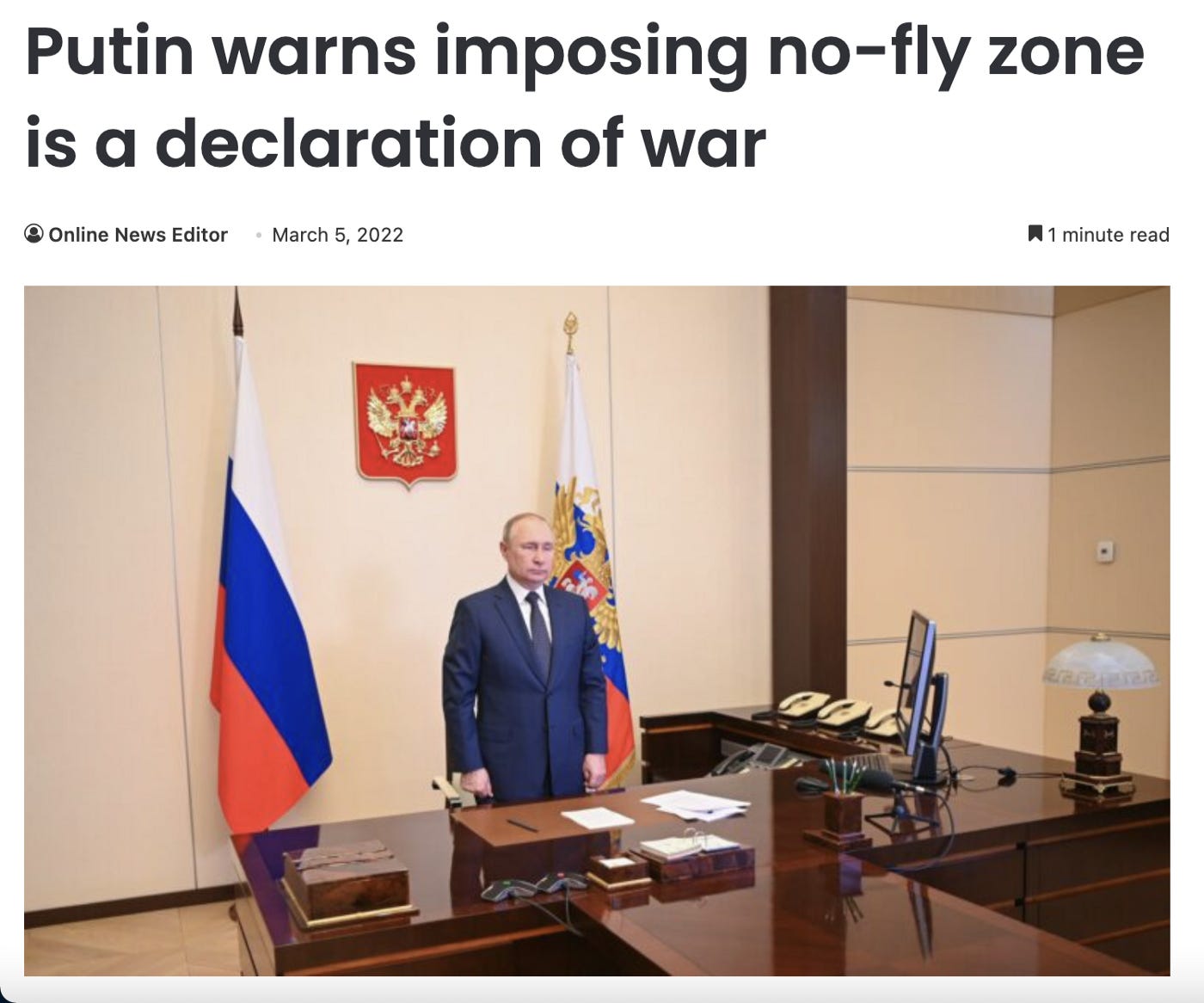 Image description: Putin stands in an office, flanked by two flags of Russia, with the Russian coat of arms behind him. He is wearing a dark blue suit and is standing straight with his hands at his sides, facing forwards. Headline above picture is black text on a white background that reads: “Putin warns imposing no-fly zone is a declaration of war”. Article is dated “March 5, 2022” beneath.